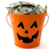 Orange pumpkin bucket full of cash