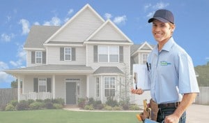 coHappy contractor in front of a house